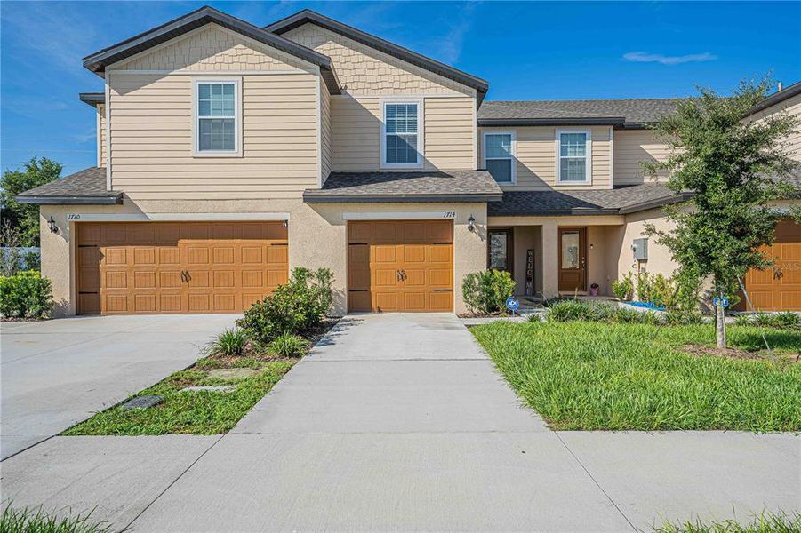 Front exterior of a new home in Hamlets of Tavares, Tavares, FL, highlighting curb appeal (Image 1). Front exterior of a new home in Hamlets of Tavares, Tavares, FL, highlighting curb appeal (Image 1).