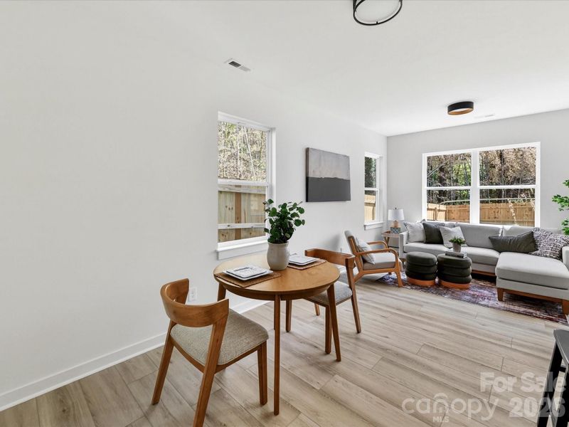 Bright and cozy breakfast nook with abundant natural light, offering the perfect spot for casual dining and morning coffee.