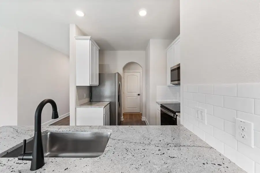 Kitchen with 42" cabinets and spacious pantry.