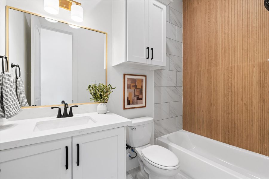 Stylish full bathroom on the second floor, serving multiple purposes - perfect for guests or residents of the adjacent bedroom. Stylish full bathroom on the second floor, serving multiple purposes - perfect for guests or residents of the adjacent bedroom.