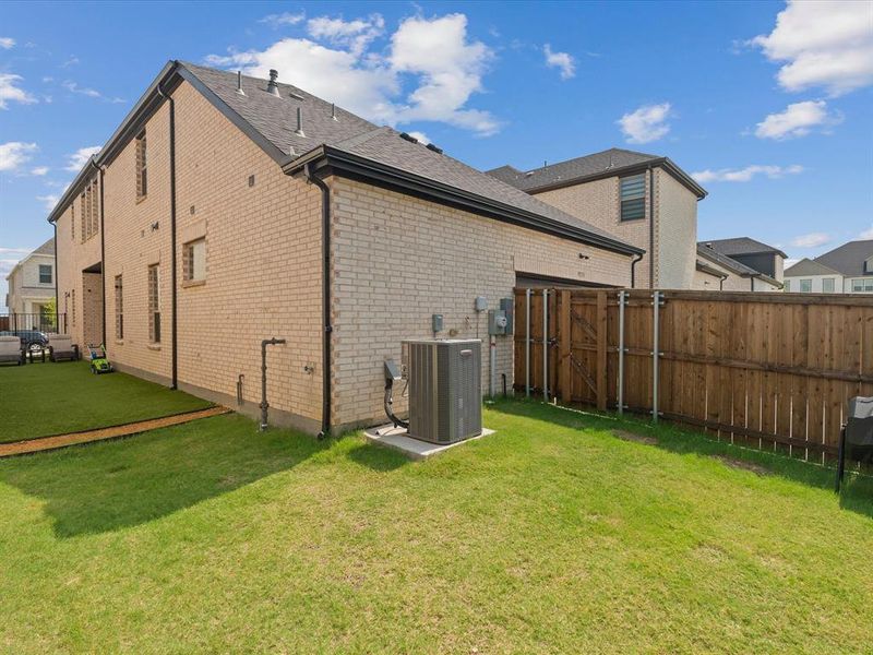 Exterior details and patio area of a home in Village on Main Street, Frisco (Image 3).