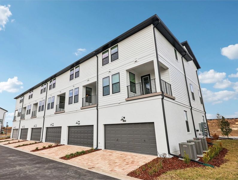 Front exterior of a new home in Parkview at Hamlin, Winter Garden, FL, highlighting curb appeal (Image 18).
