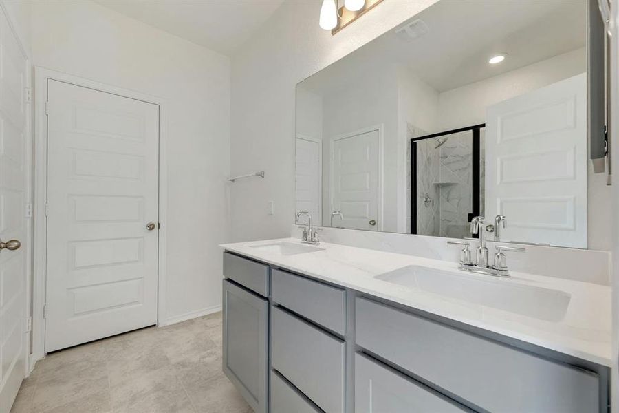 Spa-like master bath with dual sinks, and separate shower.