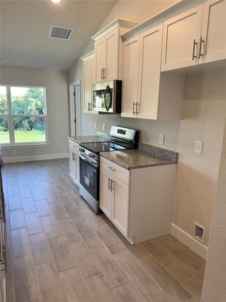 Furnished interior view inside a new home in , Port Charlotte (Image 6).
