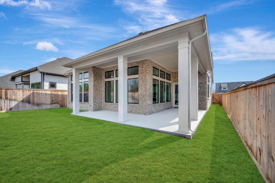 Exterior details and patio area of a home in Kresston - Enclave Collection, Magnolia (Image 25).