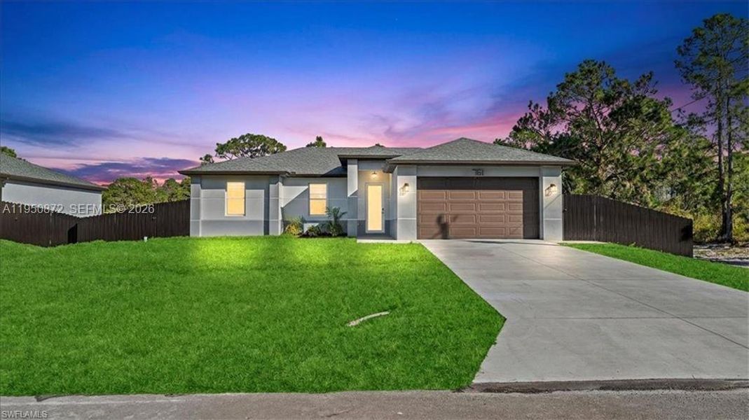 Front exterior of a new home in , Lehigh Acres, FL, highlighting curb appeal (Image 22).