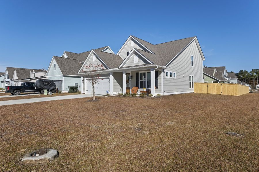 Exterior details and patio area of a home in High Point at Foxbank, Moncks Corner (Image 23).