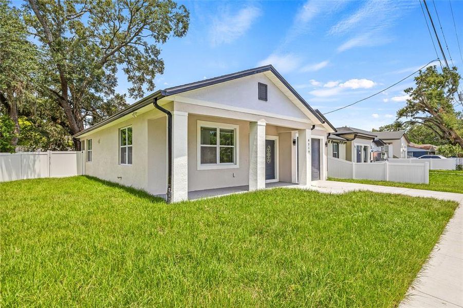 Front exterior of a new home in , Tampa, FL, highlighting curb appeal (Image 26).