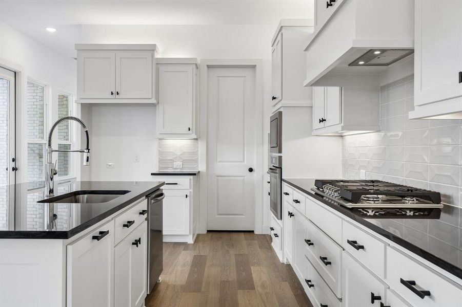 Featuring a classic black and white color palette, this dream kitchen is waiting for you to call it your own!