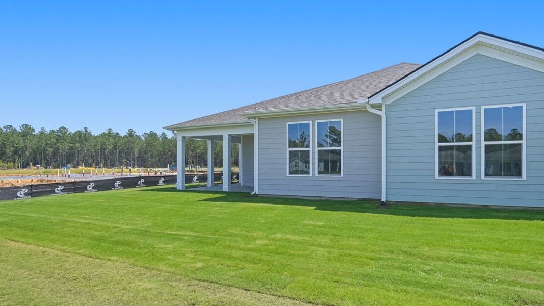 Exterior details and patio area of a home in Sun City Hilton Head, Bluffton (Image 27).