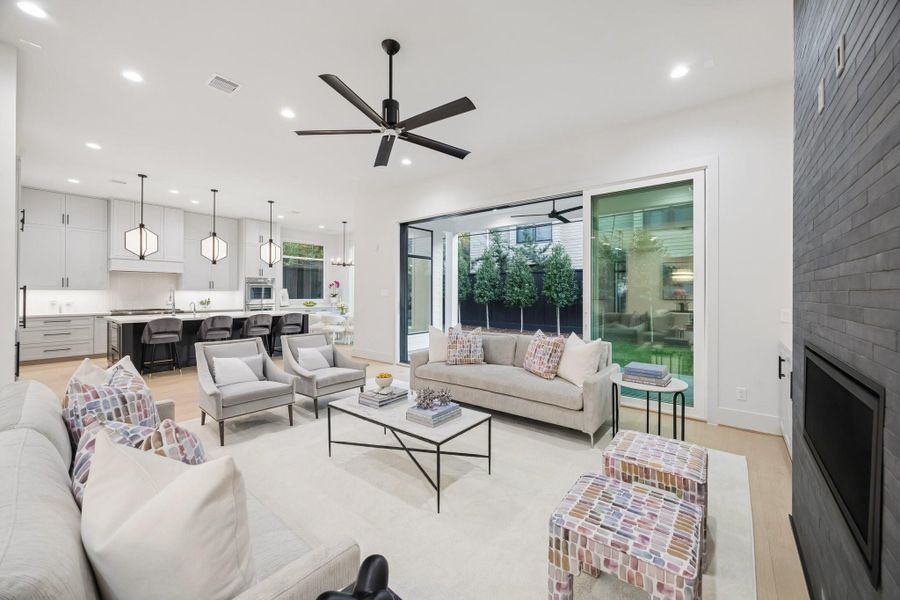 Generous size Family Room with a 42” Linear Direct Vent Fireplace with a 2 x18 Sahara Charcoal Tile Surround. There is a Conduit above the Fireplace for a TV and a Ceiling Fan. This Room is also Pre-Wired for Home Theatre (5 Speaker Locations and 1 Sub-Woofer).