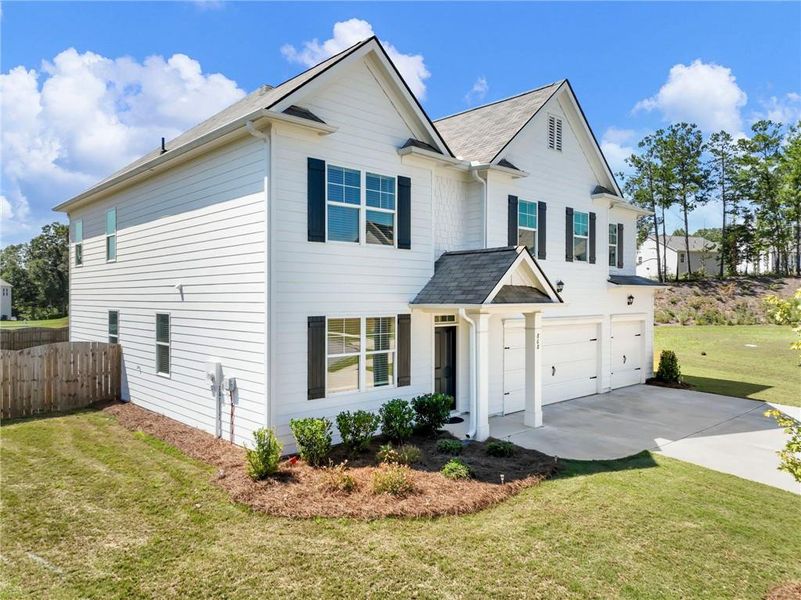 Front exterior of a new home in , Braselton, GA, highlighting curb appeal (Image 26). Front exterior of a new home in , Braselton, GA, highlighting curb appeal (Image 26).