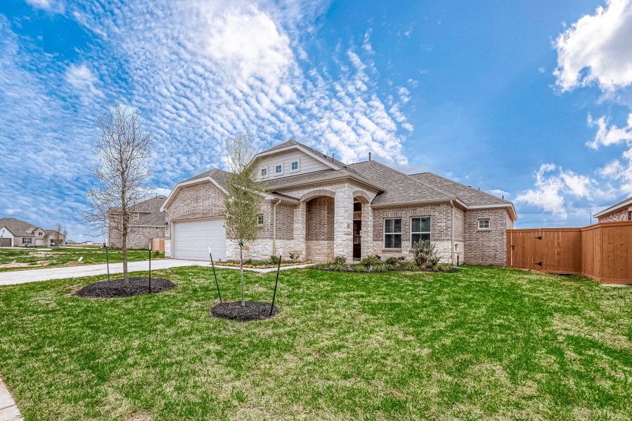 Representative exterior photo of a completed home built from the Floor Plan 1830 by Colina Homes in Grand Magnolia, Magnolia, TX (Image 27). Representative exterior photo of a completed home built from the Floor Plan 1830 by Colina Homes in Grand Magnolia, Magnolia, TX (Image 27).