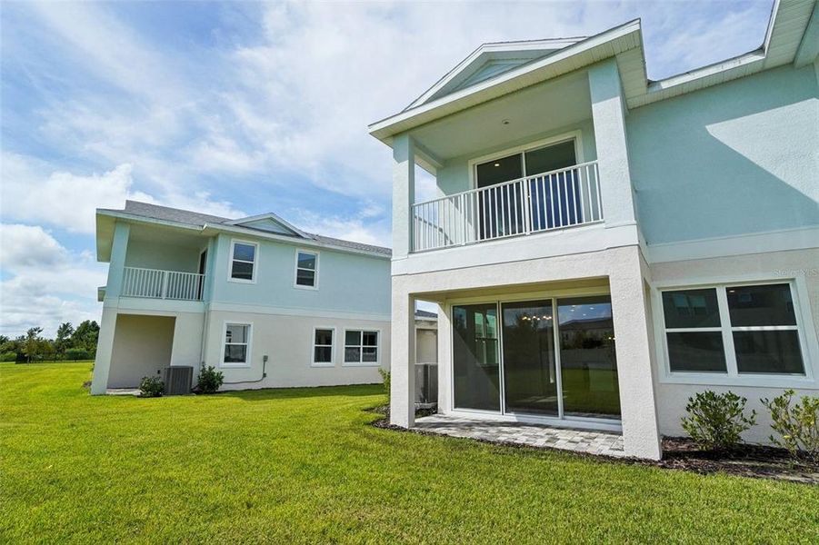 Front exterior of a new home in Lagoon Residences at Epperson, Wesley Chapel, FL, highlighting curb appeal (Image 25). Front exterior of a new home in Lagoon Residences at Epperson, Wesley Chapel, FL, highlighting curb appeal (Image 25).