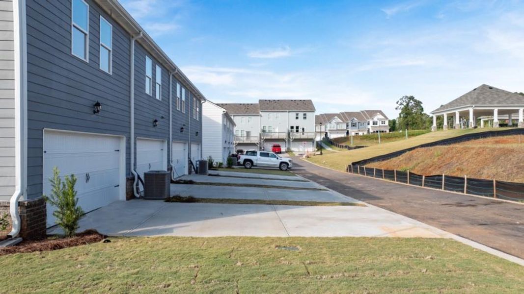 Exterior details and patio area of a home in Waypoint, Flowery Branch (Image 18).