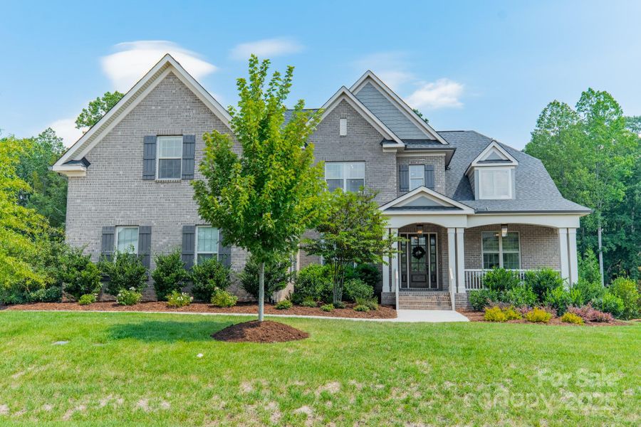 Front exterior of a new home in , Waxhaw, NC, highlighting curb appeal (Image 2).