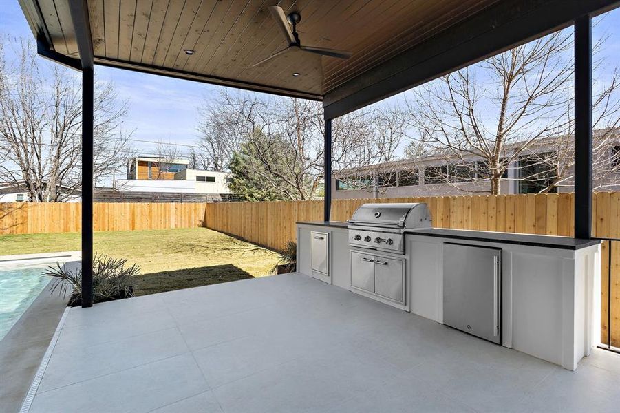 Covered outdoor kitchen and living area