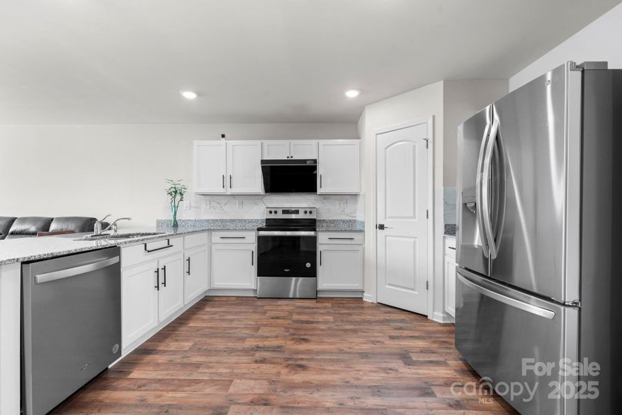 Furnished interior view inside a new home in , Lenoir (Image 16).