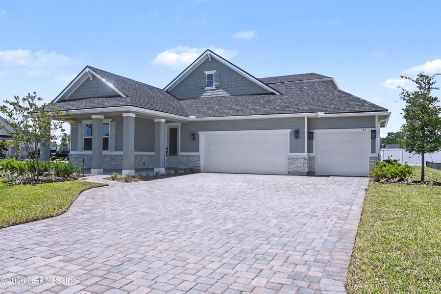 Front exterior of a new home in Brookestone, St. Augustine, FL, highlighting curb appeal (Image 2). Front exterior of a new home in Brookestone, St. Augustine, FL, highlighting curb appeal (Image 2).