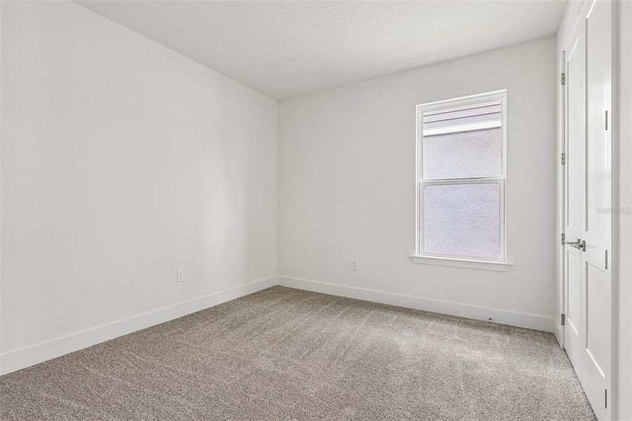 Spacious, unfurnished interior of a new home in Lakeside at Satilla, St. Cloud (Image 19).