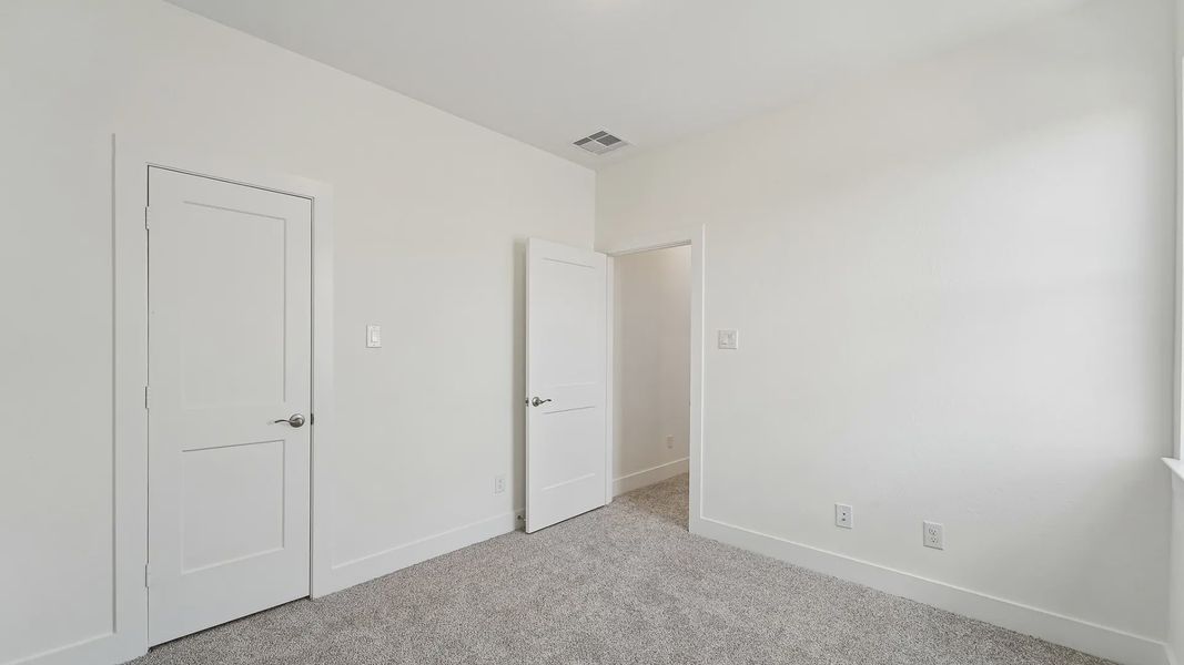 Representative unfurnished interior of a home built from the Cayman by Chesmar Homes in Crescent Bluff, Georgetown (Image 45).