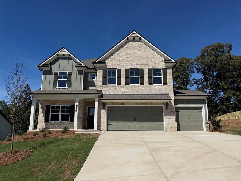 Front exterior of a new home in Mallard’s Landing, Jefferson, GA, highlighting curb appeal (Image 2). Front exterior of a new home in Mallard’s Landing, Jefferson, GA, highlighting curb appeal (Image 2).