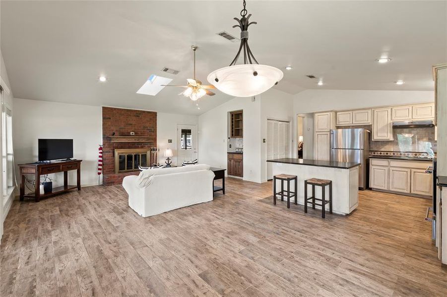 Spacious living area highlighting seamless flow from living to kitchen and dining, perfect for entertaining or relaxing with family and friends.