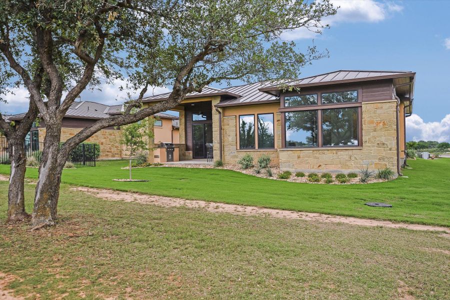 Front exterior of a home in the Lakecliff on Lake Travis community, located in Spicewood, TX (Image 4).