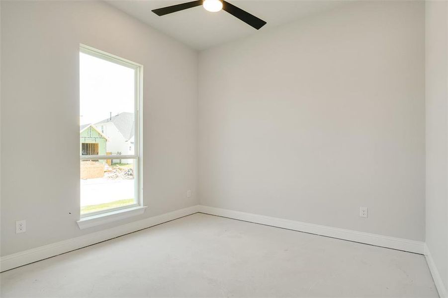 Empty room featuring ceiling fan