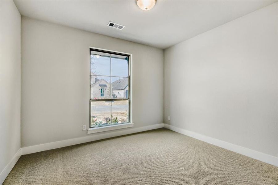 Spare room with carpet flooring and baseboards