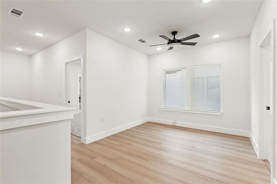 Spare room featuring light wood-style flooring, recessed lighting, and ceiling fan Spare room featuring light wood-style flooring, recessed lighting, and ceiling fan