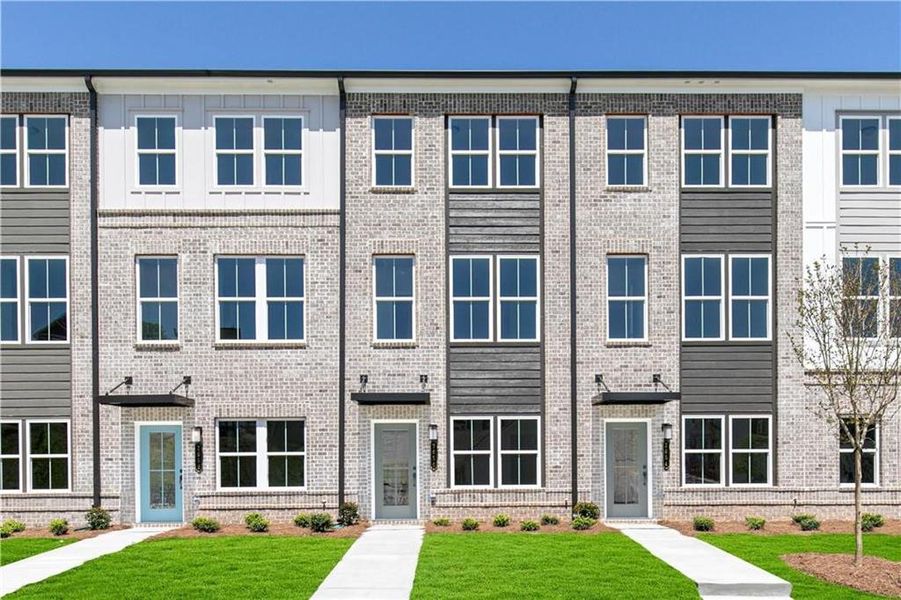 Front exterior of a new home in Westside Bend at Proctor Creek Townhomes, Atlanta, GA, highlighting curb appeal (Image 18). Front exterior of a new home in Westside Bend at Proctor Creek Townhomes, Atlanta, GA, highlighting curb appeal (Image 18).