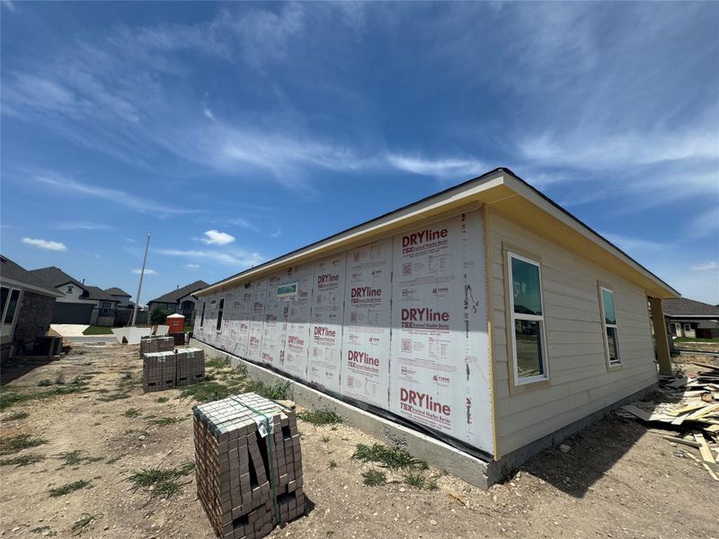 Front exterior of a new home in Village at Three Oaks, Seguin, TX, highlighting curb appeal (Image 10). Front exterior of a new home in Village at Three Oaks, Seguin, TX, highlighting curb appeal (Image 10).