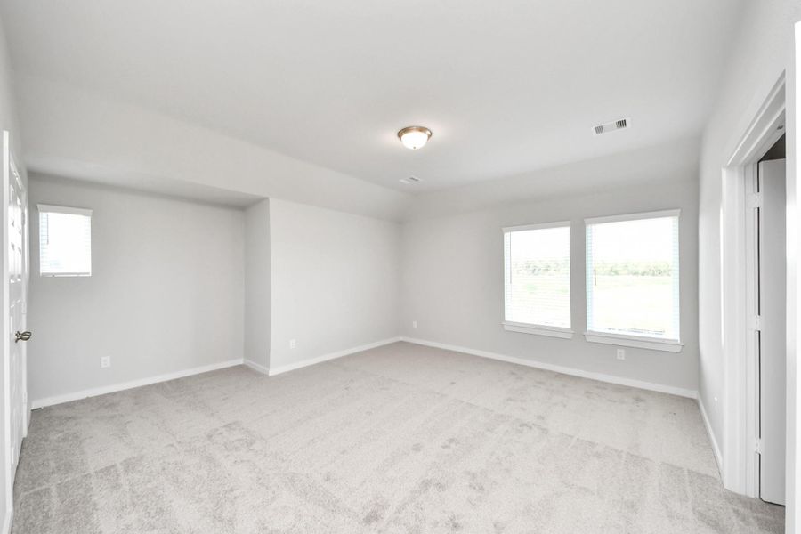 Come upstairs and enjoy a day of leisure in this fabulous game room! This is the perfect hangout spot or adult game room! Features plush carpet, high ceilings, custom paint and windows for plenty of natural light. Come upstairs and enjoy a day of leisure in this fabulous game room! This is the perfect hangout spot or adult game room! Features plush carpet, high ceilings, custom paint and windows for plenty of natural light.