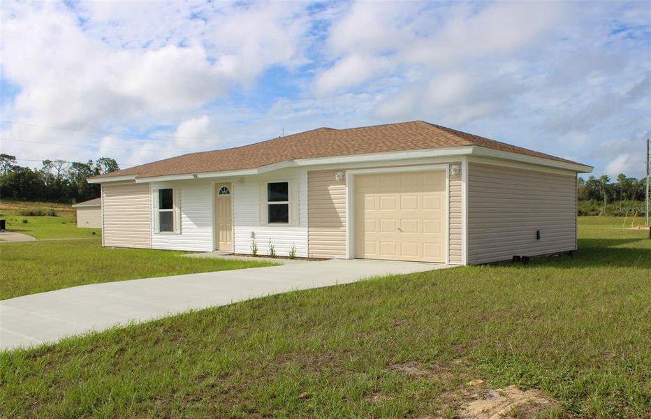 Front exterior of a new home in , Dunnellon, FL, highlighting curb appeal (Image 2). Front exterior of a new home in , Dunnellon, FL, highlighting curb appeal (Image 2).