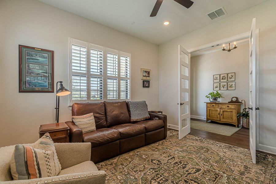 Living room featuring a ceiling fan, wood finished floors, recessed lighting, and french doors