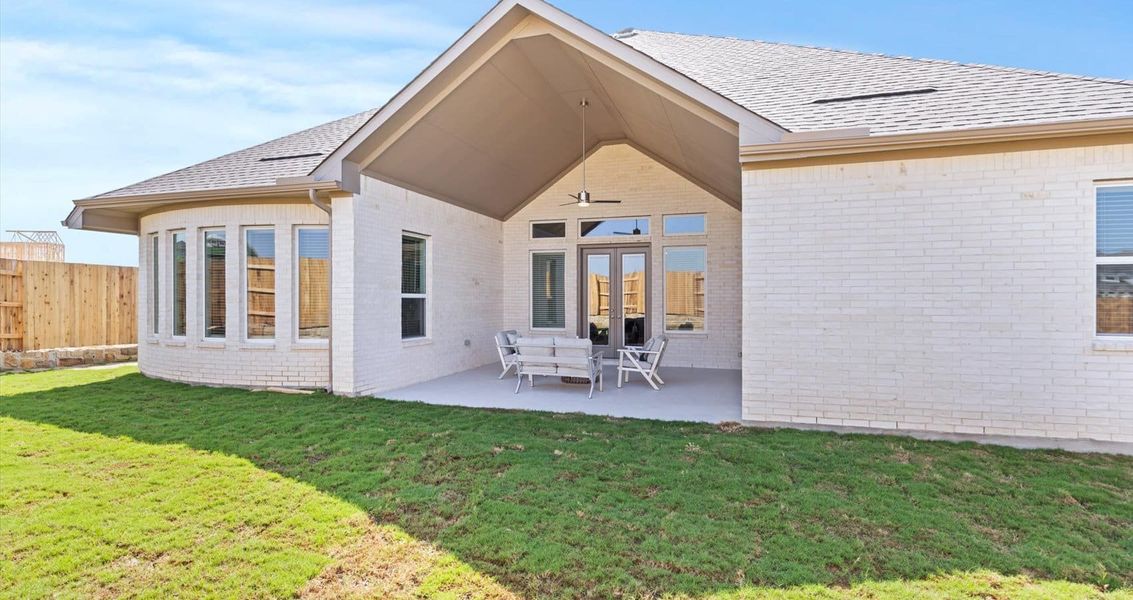 Representative exterior photo of a completed home built from the Wyatt by Chesmar Homes in Sunfield, Buda, TX (Image 13).