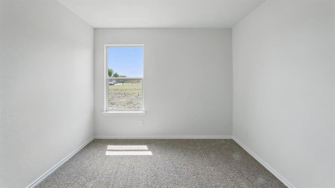 Unfurnished room featuring carpet flooring and baseboards