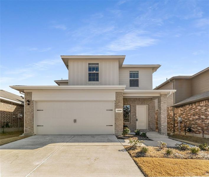 View of front of property with a garage