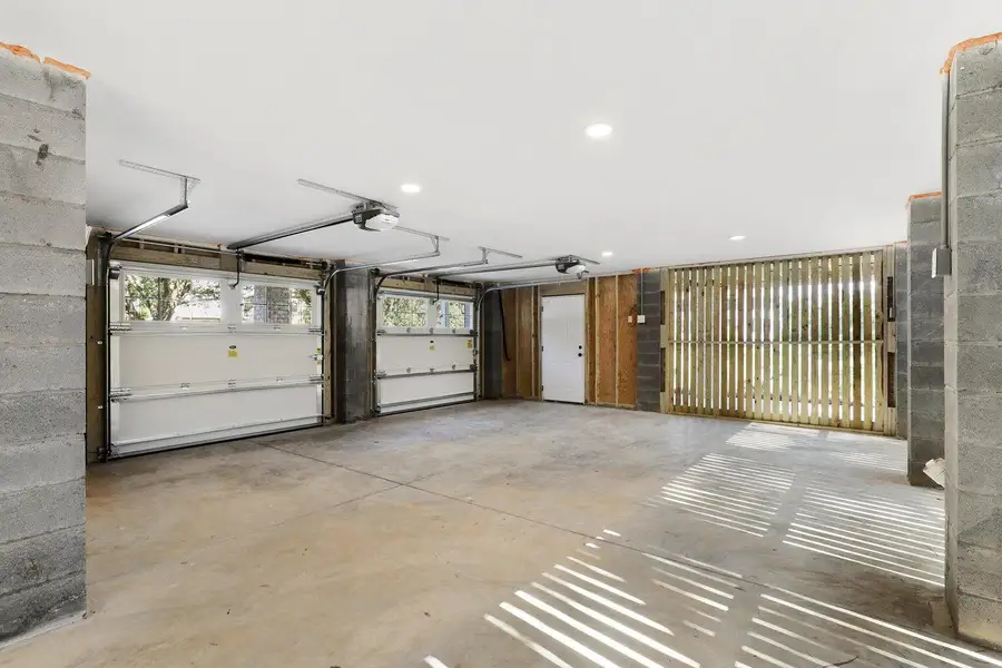 Front exterior of a new home in Overlook at Copahee Sound, Awendaw, SC, highlighting curb appeal (Image 1).