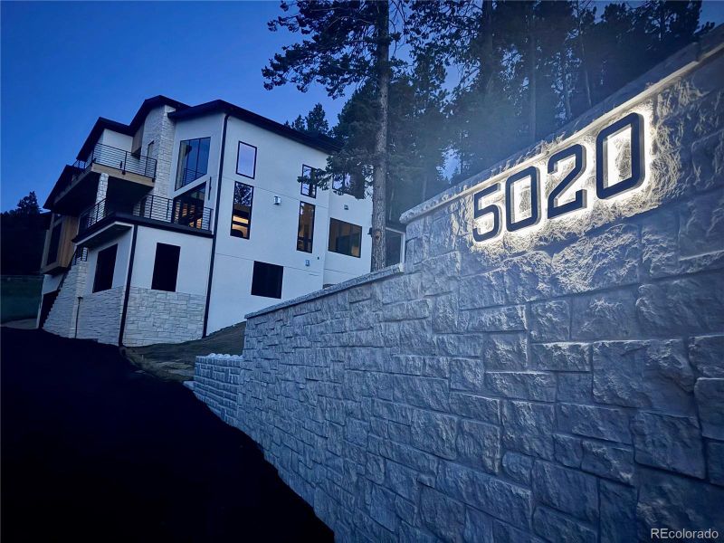Front exterior of a new home in , Evergreen, CO, highlighting curb appeal (Image 18).
