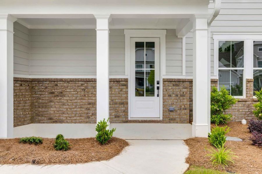 Front exterior of a new home in Maddox Landing, Hoschton, GA, highlighting curb appeal (Image 24).