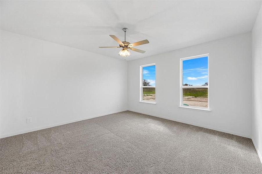 Unfurnished room with carpet flooring and ceiling fan