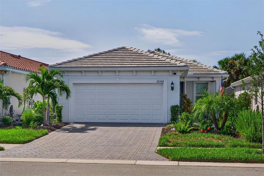 Front exterior of a new home in , Englewood, FL, highlighting curb appeal (Image 2). Front exterior of a new home in , Englewood, FL, highlighting curb appeal (Image 2).