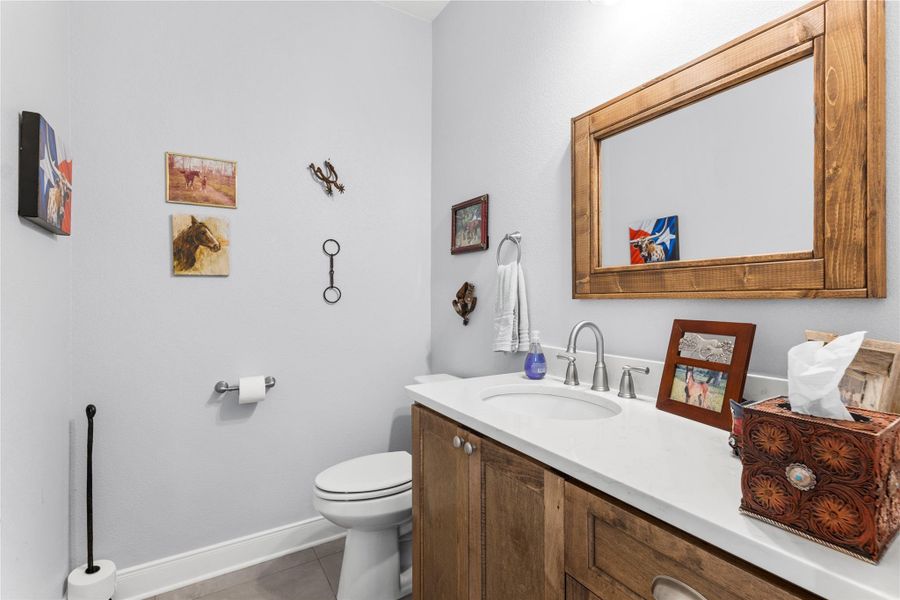 Hallway Half bath features vanity and is located off Kitchen area.