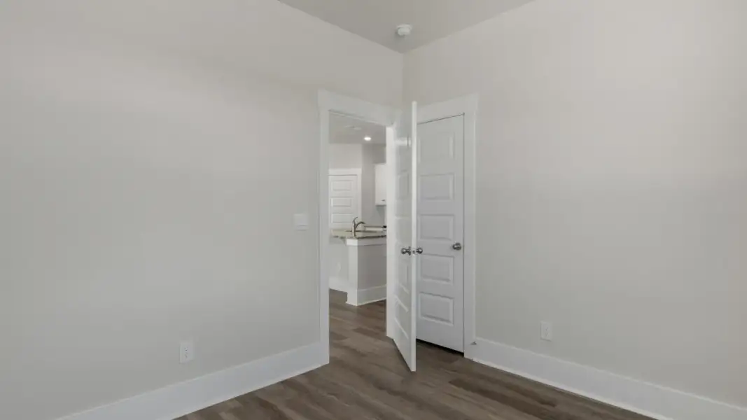 Spacious, unfurnished interior of a new home in The Retreat at Indigo Preserve Townhomes, Leland (Image 24).