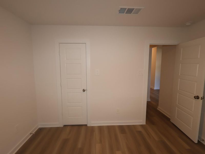 Spacious, unfurnished interior of a new home in Pinewood at Grand Texas, New Caney (Image 12).