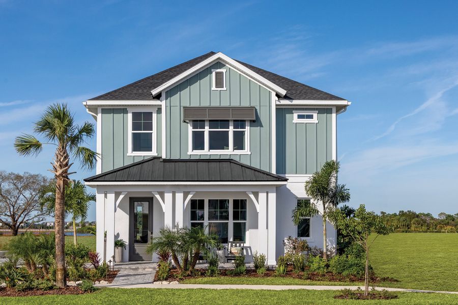 Front exterior of a new home in Emerald Landing at Waterside at Lakewood Ranch – Cottage Series, Sarasota, FL, highlighting curb appeal (Image 1). Front exterior of a new home in Emerald Landing at Waterside at Lakewood Ranch – Cottage Series, Sarasota, FL, highlighting curb appeal (Image 1).