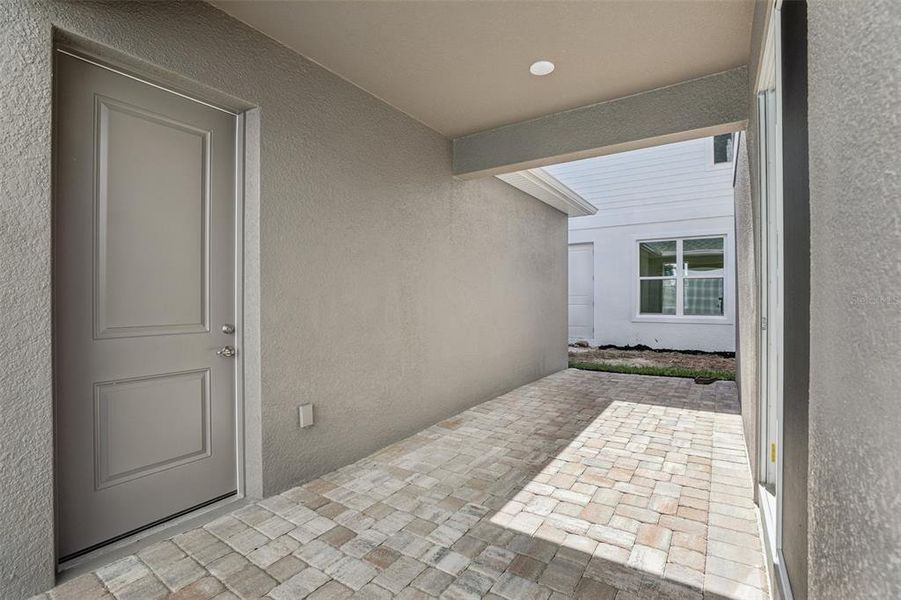 Exterior details and patio area of a home in Trinity Place, St. Cloud (Image 20).