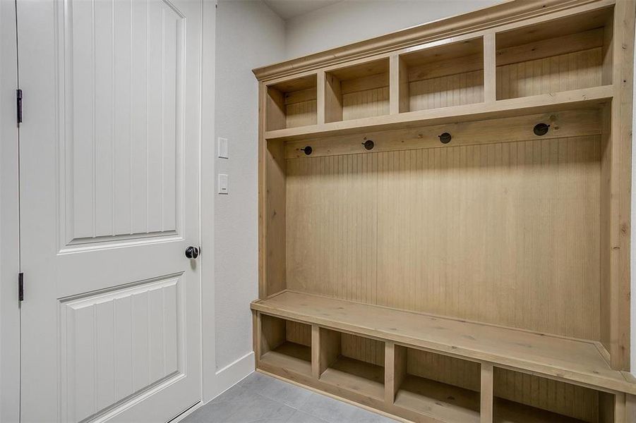 Mudroom featuring light tile patterned floors